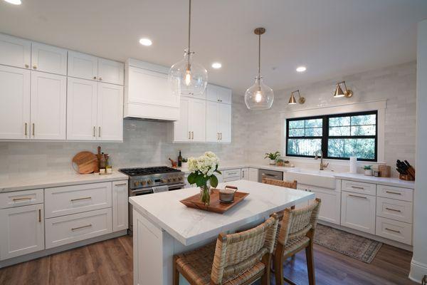 kitchen renovation. The sink has been moved, a new window is framed and installed, old window is closed, a new Island  is designed and built