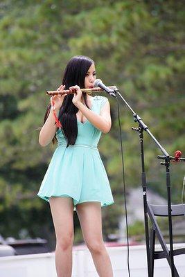 Playing the Chinese Horizontal Bamboo Flute (Dizi) at International Dragon Boat Festival.