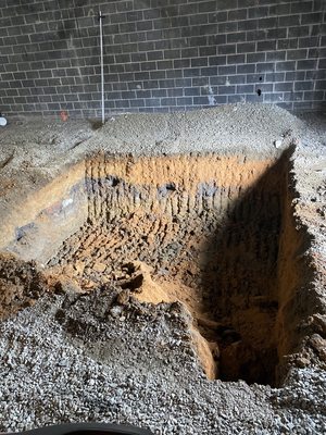 Excavation for elevator shaft.