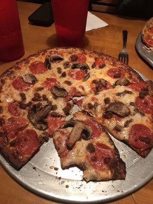 Cauliflower crust with pepperoni, beef and mushrooms.