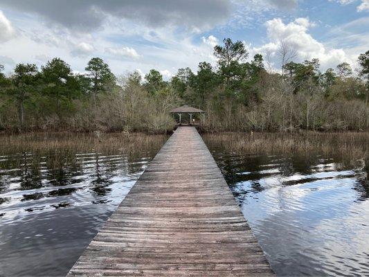 A pier on the lake you can walk on. There is a bench you can sit on.