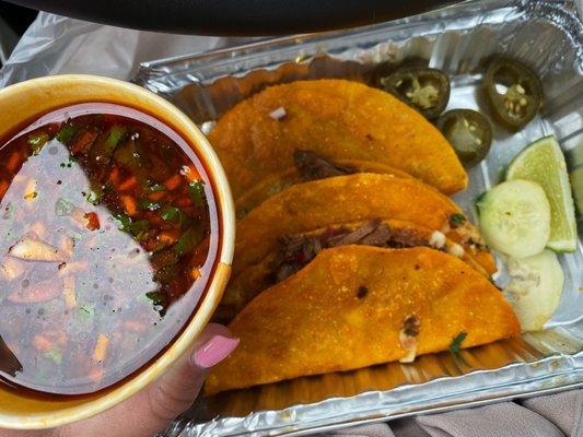 Birria tacos with birria consomé