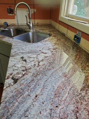 Typhoon Bordeaux granite countertop. Installed by Super Star Granite in Iowa City.