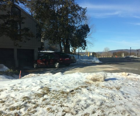 His 2 garages with PLENTY of space for his dumpster!