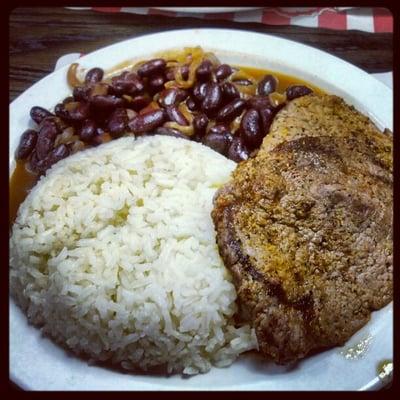 Delicious carne asada (skirt steak) with rice and beans.