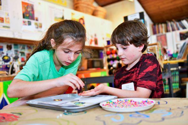 Campers paint, draw, create crafts, build with clay, and more in our airy art room.