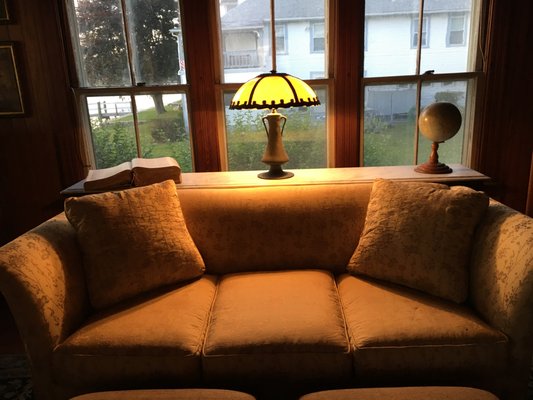 This couch needed structural repair and new upholstery;  Gozzo also built the marble table for our lamp, dictionary, & globe.  Perfection.