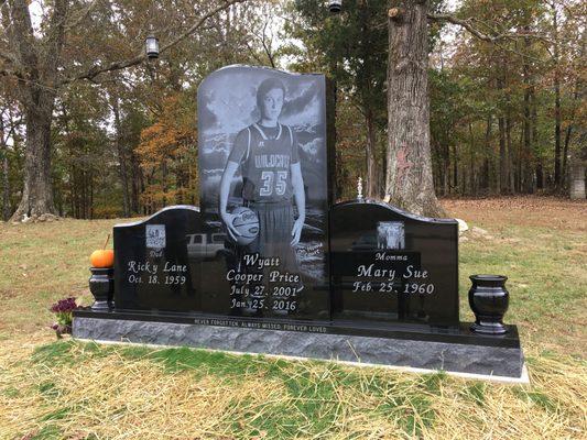 Completely Custom Black Granite Monument with Life-size Laser Etchings.