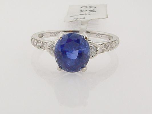 Deep Blue Tanzanite with accent side Diamonds in 18k White gold