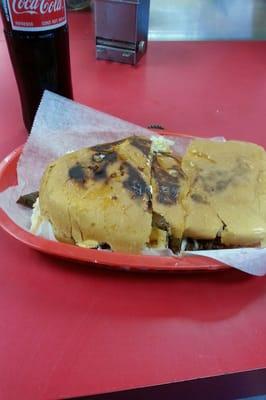 Delicious fajita torta and a mexican soda.