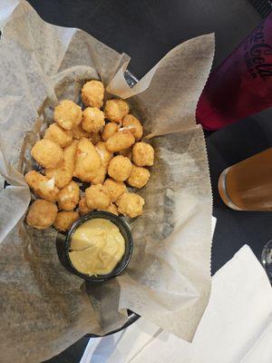 Cheese curds and spicy cheese balls. Honey mustard sauce.