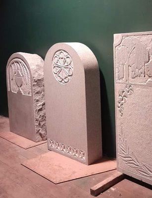 Examples of granite headstones that where inspired by early new england gravestones.