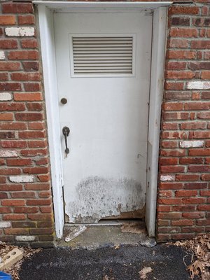 Before photo of damaged door