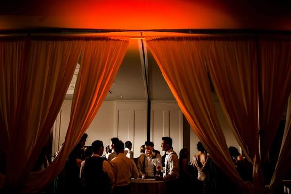 uplighting on the curtains separating the ballroom from the bar