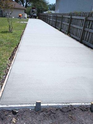 Plain broom finished concrete driveway