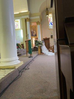 Sneak Peek of the Bride & Groom from the side (piano/choir area) - #itsAbadDamnTime