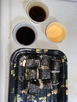 Spicy Mayo, unagi, soy sauce, with sushi rolls