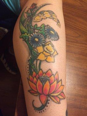 This is a second tattoo he designed of birth flowers of members in my family.