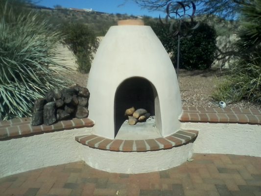 Construction of fire place in patio.