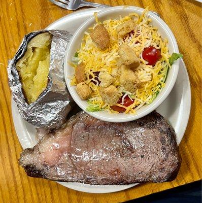 Smoked prime rib, baked potato and salad