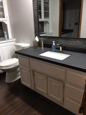 Same black granite with undermount sinks and flat edges