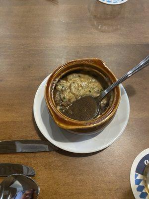 Beef broth soup I believe, resembling a French onion soup