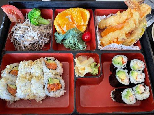 Bento Box with soba salad, tempura, crunch roll, and California roll.