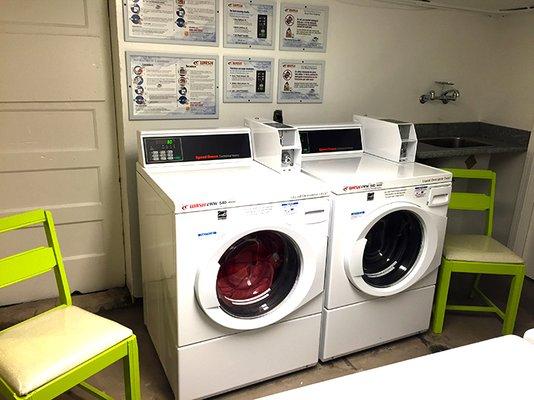 On site laundry, in a tidy, well-kept laundry room.