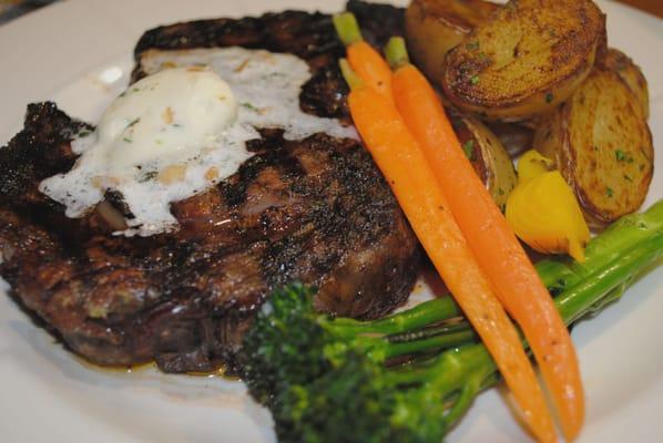 The Ribeye Grilled 14 oz ribeye steak with our own specialty rub and garlic butter