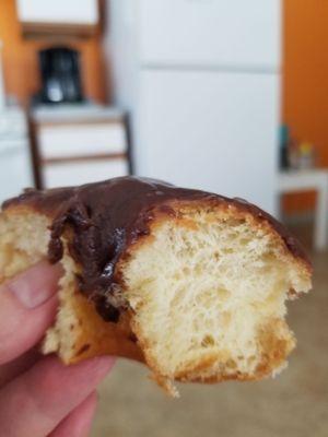 Half of a chocolate donut. Fresh,  thick, moist donut. Totally worth sabbatoging your diet, lol