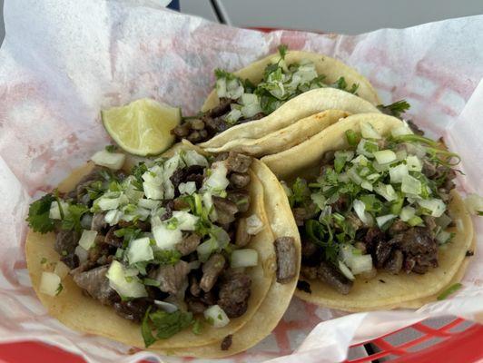 Carne asada onion and cilantro tacos.