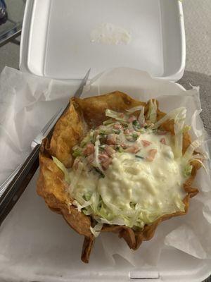 Shredded chicken taco salad covered in cheese sauce