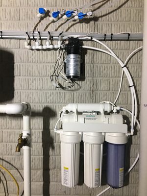 Reverse osmosis system with booster pump and manifold.