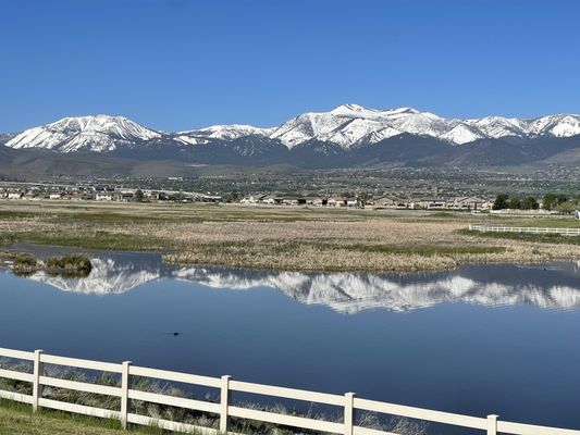 View of the marsh and mountains from walking trail at Damonte Rancb Park