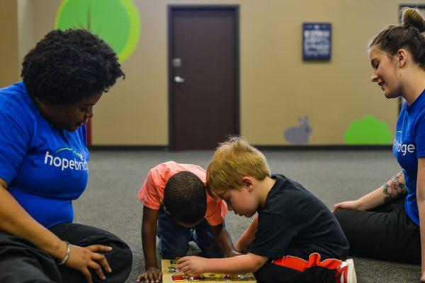 RBTs working 1 on 1 with their kiddos for ABA therapy.