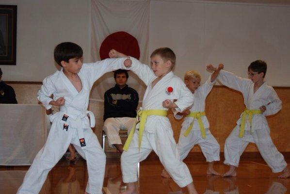 One punches, while the other blocks. Starting slowly, by the count, and knowing who will do what technique.