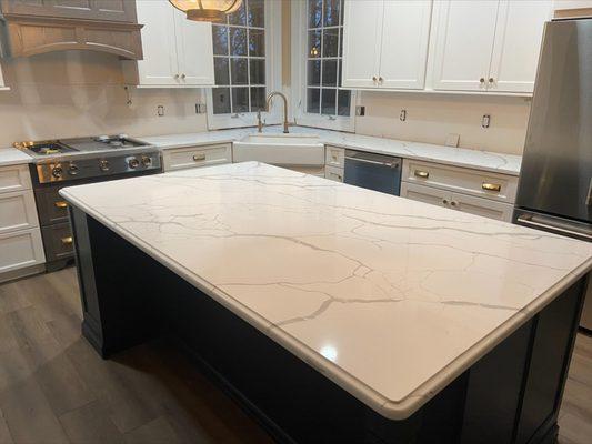 Calacatta Laza Quartz with waterfall edge profile.