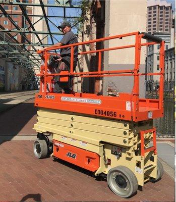 Technician Mark Hamilton delivers a scissor lift to the folks at the the Virginia Hispanic Chamber for a festival on the Canal, Richmond, VA