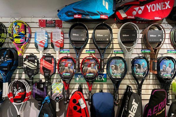 Tennis rackets, strings, bags, balls, shoes, and accessories.