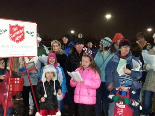 5th and 6th grade Youth Group at Calvary United Methodist Church caroling and ringing the bell for The Salvation Army.