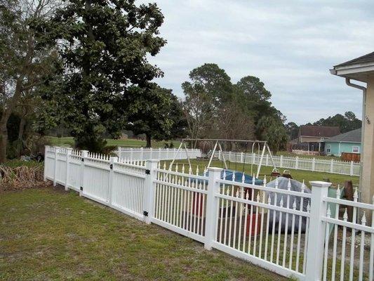 Specialty vinyl picket fence with double gates in Panama City Beach, Fl.