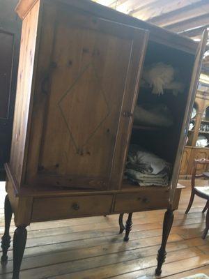 Linen chifferobe or media cabinet.