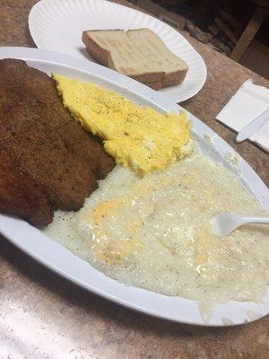 Cheese grits, fried tilapia, eggs and toast $9. Somebody smack me.