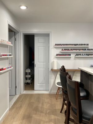 Nail selection at back of salon and rooms for facials/waxing