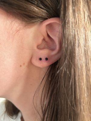 Left ear, earrings placed more normal