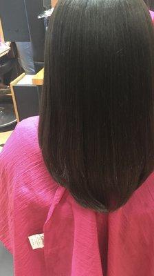 Wash and blow dry on natural hair with a trim