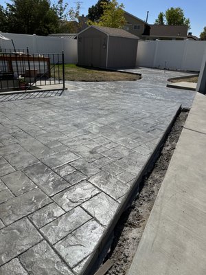 Custom colored and stamped concrete on this backyard patio.