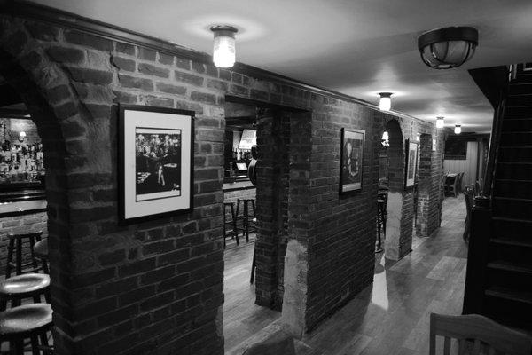 A photo of Chris Murray with Andy Warhol and a view from the stairs leading down from the Darlington House restaurant.