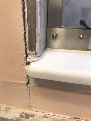 How shower glass was attached