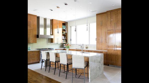 Large format kitchen floor installed and glass kitchen backsplash